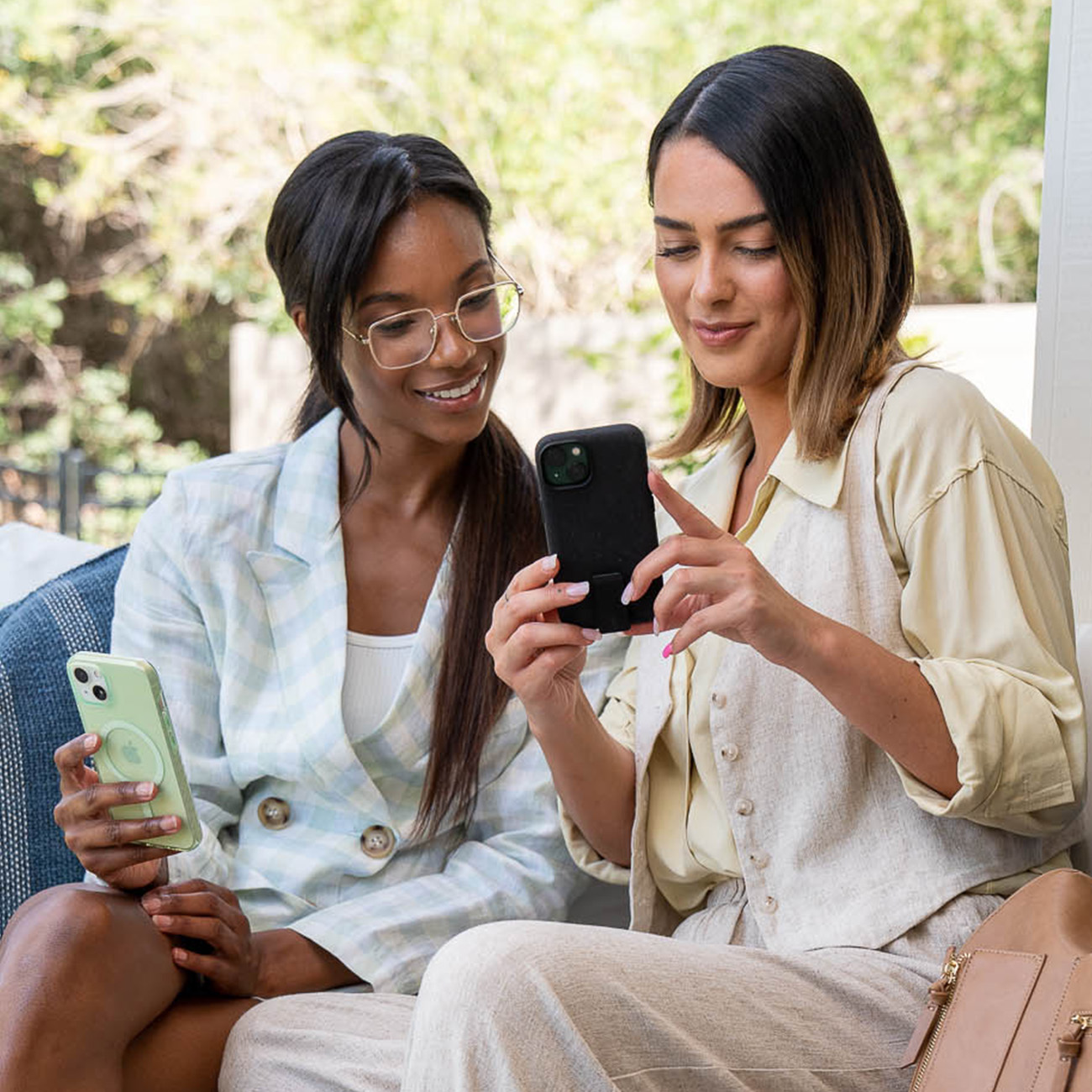 Two women using their iPhone 14 screen